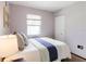 Comfortable bedroom with soft lighting, neutral tones, and ample closet space at 4945 Camphor Ave, Sarasota, FL 34231