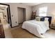 Bright bedroom boasts ample closet space and a large window for natural light at 4945 Camphor Ave, Sarasota, FL 34231