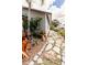 Attractive home exterior with tropical landscape, stone walkway, and well maintained facade at 4945 Camphor Ave, Sarasota, FL 34231