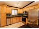Bright kitchen with stainless steel appliances, and granite countertops at 4945 Camphor Ave, Sarasota, FL 34231