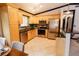 Well-equipped kitchen featuring stainless steel appliances, granite countertops, and a breakfast bar at 4945 Camphor Ave, Sarasota, FL 34231