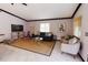 Bright living room with contemporary decor, a comfortable sofa, and a large area rug at 4945 Camphor Ave, Sarasota, FL 34231