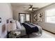 Bedroom with queen bed, stylish linens, and large window at 4945 Camphor Ave, Sarasota, FL 34231