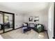 Cozy room features comfy seating, stylish art, and a peek into the main bedroom at 4945 Camphor Ave, Sarasota, FL 34231