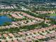 Expansive aerial view showcasing the Esplanade community with pristine lakes and lush landscaping at 4949 Savona Run, Bradenton, FL 34211
