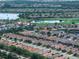 Expansive aerial view of a community with a golf course, lakes, and neatly arranged homes at 4949 Savona Run, Bradenton, FL 34211
