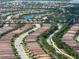 Captivating aerial view of the Esplanade neighborhood featuring winding roads and scenic lakes at 4949 Savona Run, Bradenton, FL 34211