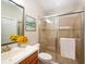 Bright bathroom featuring a glass-enclosed shower and modern vanity at 4949 Savona Run, Bradenton, FL 34211