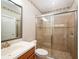 Bright bathroom featuring a glass-enclosed shower and modern vanity at 4949 Savona Run, Bradenton, FL 34211