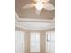 Close up of bedroom tray ceiling, crown moulding, and window shutters at 4949 Savona Run, Bradenton, FL 34211