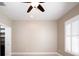 Comfortable bedroom featuring shutters and ceiling fan at 4949 Savona Run, Bradenton, FL 34211