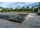 Bocce ball court with seating area and lush landscaping provides a social and recreational amenity for residents at 4949 Savona Run, Bradenton, FL 34211