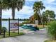 Community canoe and kayak launch on a picturesque lake, complete with signage and available watercraft at 4949 Savona Run, Bradenton, FL 34211