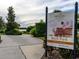 Community dog park at Esplanade Golf and Country Club, featuring a bark park sign and walking path at 4949 Savona Run, Bradenton, FL 34211
