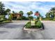 Community entrance with 'Stop' sign, visitor and resident directions, and lush landscaping at 4949 Savona Run, Bradenton, FL 34211