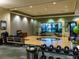 Spacious exercise room with free weights, yoga mats, and views of the greenery outside at 4949 Savona Run, Bradenton, FL 34211