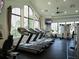 Bright fitness center featuring state-of-the-art treadmills and large windows with natural light at 4949 Savona Run, Bradenton, FL 34211