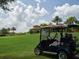 Golf carts are available for players on the course with beautiful homes and lush greenery nearby at 4949 Savona Run, Bradenton, FL 34211