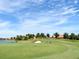 Enjoy a day on the lush green golf course with blue skies, mature landscaping, and beautiful homes nearby at 4949 Savona Run, Bradenton, FL 34211