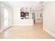 Bright and airy living room with tile flooring, open to the kitchen and flooded with natural light at 4949 Savona Run, Bradenton, FL 34211