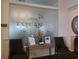 Welcoming lobby with frosted glass featuring the Esplanade logo and comfortable seating at 4949 Savona Run, Bradenton, FL 34211
