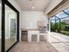 Outdoor kitchen equipped with stainless steel grill, refrigerator and granite countertop at 4949 Savona Run, Bradenton, FL 34211