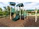 Fun community playground featuring slides and climbing structures, with a gazebo in the background at 4949 Savona Run, Bradenton, FL 34211