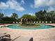 Unique circular pool with center island and lounge chairs offers a private and tranquil retreat for relaxation at 4949 Savona Run, Bradenton, FL 34211