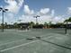 Beautifully maintained tennis court with professional lighting, showcasing the community's recreational amenities at 4949 Savona Run, Bradenton, FL 34211