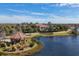 A walking path leads past a gazebo on a lake on the way to a community clubhouse at 5117 Serata Dr, Bradenton, FL 34211