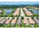 An aerial view showcases the community, with views of lakes and beautiful streets at 5117 Serata Dr, Bradenton, FL 34211