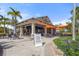 Outdoor bar area at Bahama Bar with seating and signage stating shirt and coverup requirements at 5117 Serata Dr, Bradenton, FL 34211