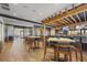 The bar features modern seating, TVs, and an open floor plan for an entertaining space at 5117 Serata Dr, Bradenton, FL 34211