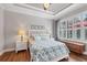 Cozy bedroom with natural light, hardwood floors, and decorative lamps on the bedside tables at 5117 Serata Dr, Bradenton, FL 34211