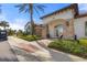 An elegant clubhouse entrance features stone accents, arched entryway and golf cart parking at 5117 Serata Dr, Bradenton, FL 34211