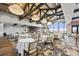 This dining area features large windows, vaulted ceilings, and decorative lighting for an inviting space at 5117 Serata Dr, Bradenton, FL 34211