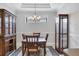 Formal dining room featuring coffered ceilings, china cabinets and a decorative area rug at 5117 Serata Dr, Bradenton, FL 34211
