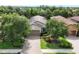 Inviting single-Gathering home featuring a well-manicured lawn and brick driveway at 5117 Serata Dr, Bradenton, FL 34211