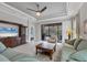 Cozy living room featuring tile flooring, ceiling fan, and a sliding door to outdoor patio at 5117 Serata Dr, Bradenton, FL 34211