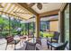 Enclosed patio features an outdoor kitchen and ample seating, perfect for outdoor entertaining at 5117 Serata Dr, Bradenton, FL 34211