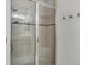 Shower with glass door, and updated fixtures enhances the luxurious feel of this bathroom at 5117 Serata Dr, Bradenton, FL 34211