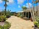 Landscaped paver patio with beautiful plants and trees at 5207 86Th Street W Ct, Bradenton, FL 34210