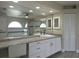 Bathroom boasts granite counters, white cabinets, walk in shower and tub at 5207 86Th Street W Ct, Bradenton, FL 34210