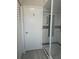 Bathroom door and glass shower stall with mosaic tile floor at 5207 86Th Street W Ct, Bradenton, FL 34210