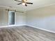 This bedroom includes laminate flooring and a unique frosted glass sliding door at 5207 86Th Street W Ct, Bradenton, FL 34210