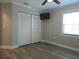 Bedroom features laminate flooring, closet, ceiling fan, and window at 5207 86Th Street W Ct, Bradenton, FL 34210