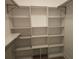 Walk-in closet with built-in shelving for organized storage at 5207 86Th Street W Ct, Bradenton, FL 34210