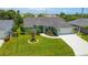 Charming single-story home with a well-manicured lawn and attached two car garage at 5207 86Th Street W Ct, Bradenton, FL 34210