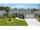 Charming single-story home with a well-manicured lawn and attached two car garage at 5207 86Th Street W Ct, Bradenton, FL 34210