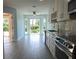 Bright kitchen with stainless appliances, stone countertops, and a lovely bay window to the garden at 5207 86Th Street W Ct, Bradenton, FL 34210